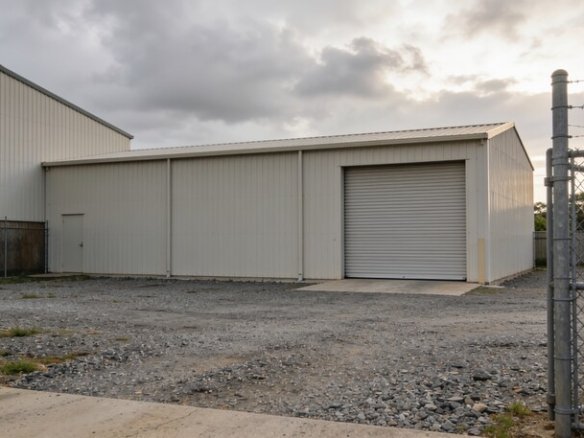 Closed factory gate and roller door at an industrial site on the Sunshine Coast, Queensland