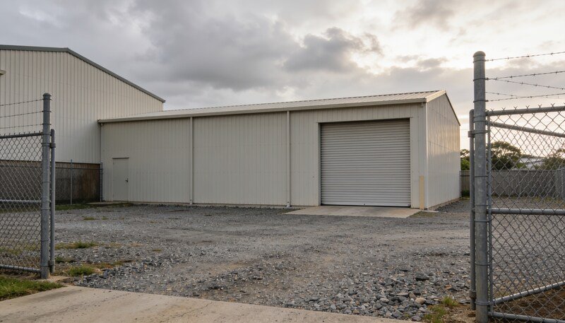 Closed factory gate and roller door at an industrial site on the Sunshine Coast, Queensland