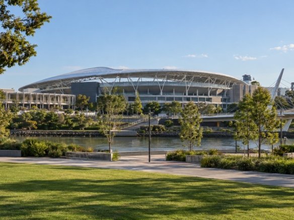Modern stadium and surrounding sports precinct with landscaped public space in Brisbane