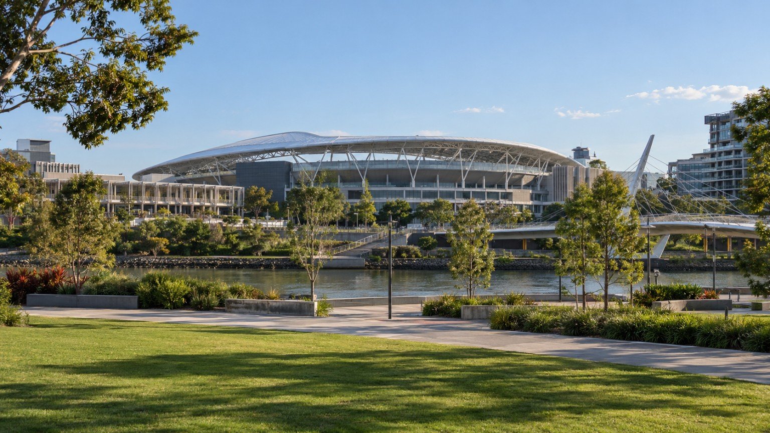 Modern stadium and surrounding sports precinct with landscaped public space in Brisbane