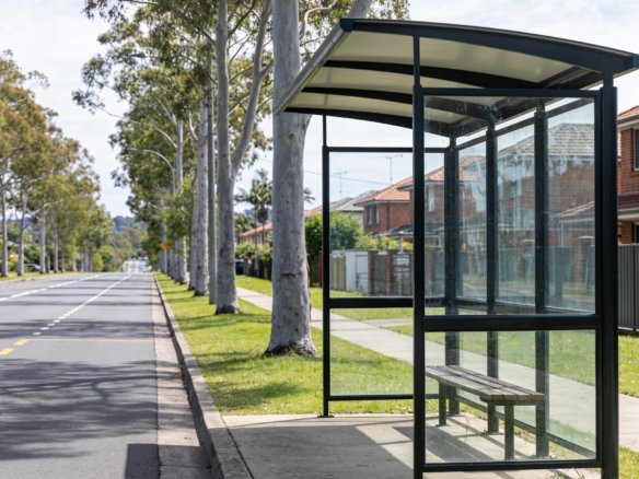 Bus shelter beside a tree-lined arterial road in Calamvale, southern Brisbane