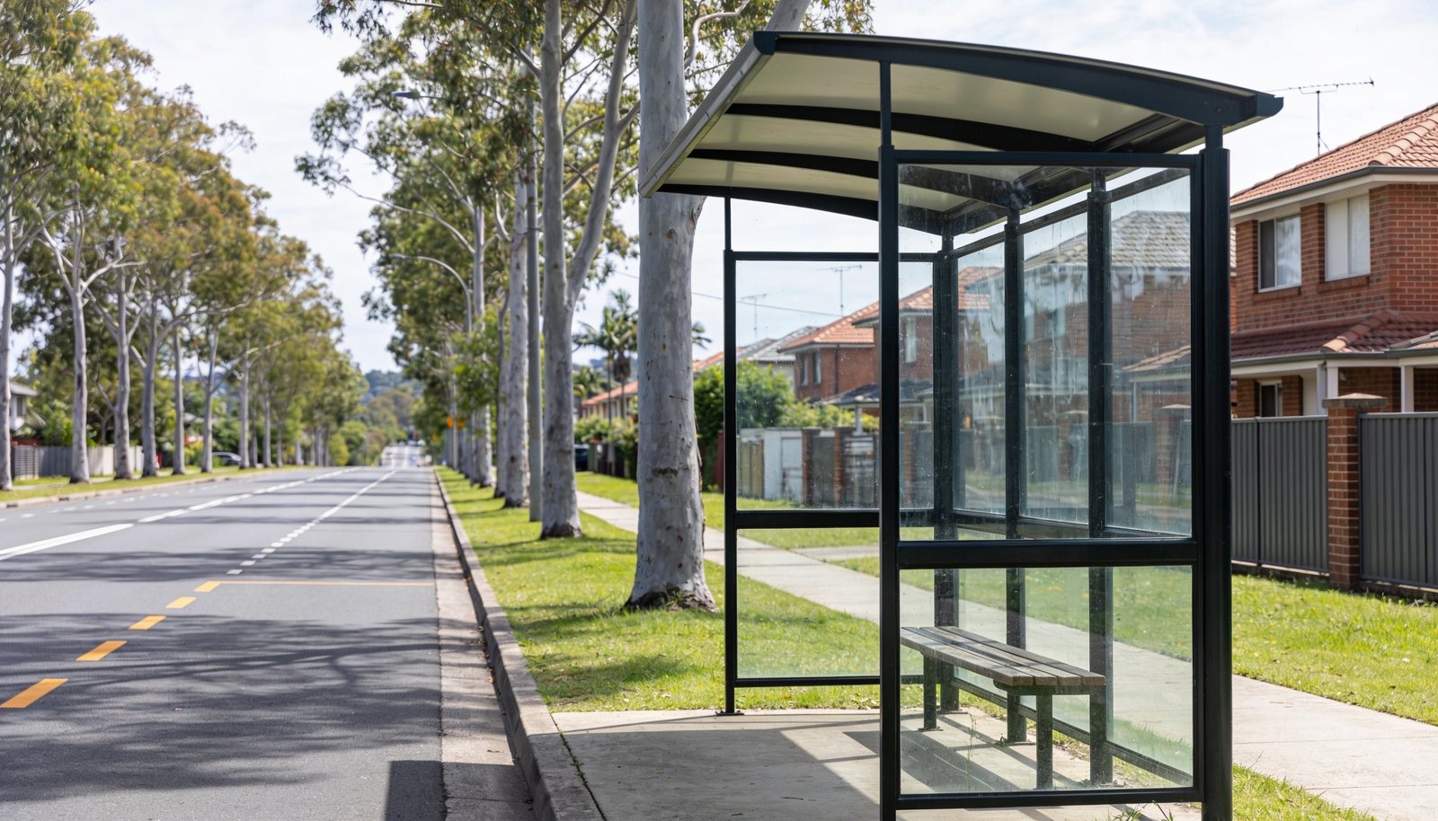 Bus shelter beside a tree-lined arterial road in Calamvale, southern Brisbane
