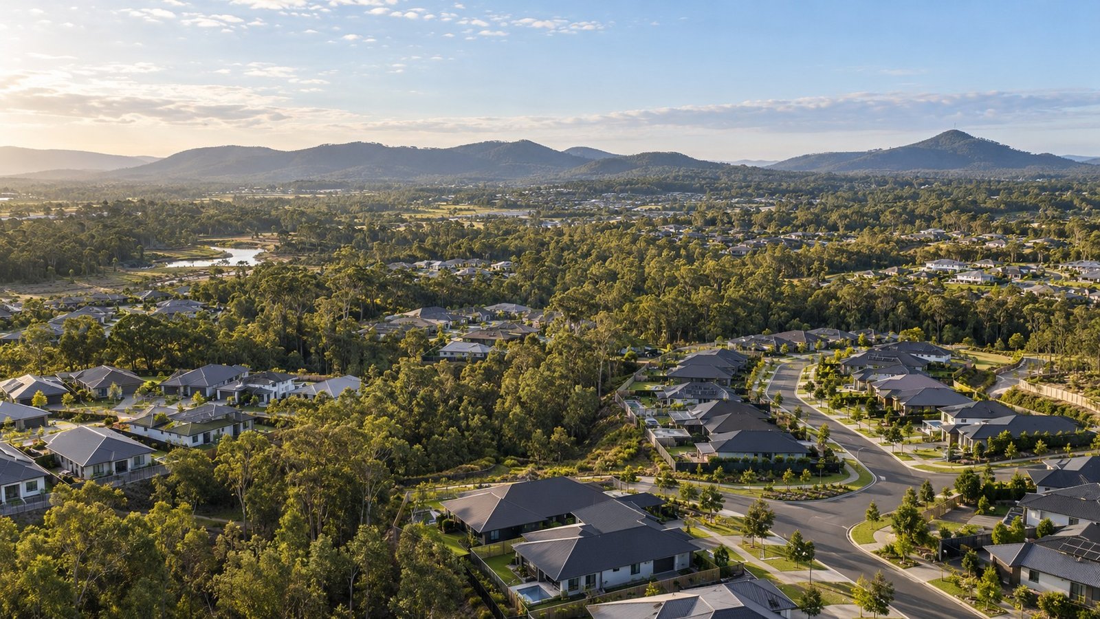 Master-planned residential growth area with new homes and remnant bushland