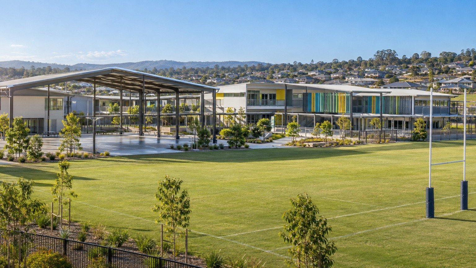 Modern Queensland school buildings and sports field serving a growing Logan corridor community