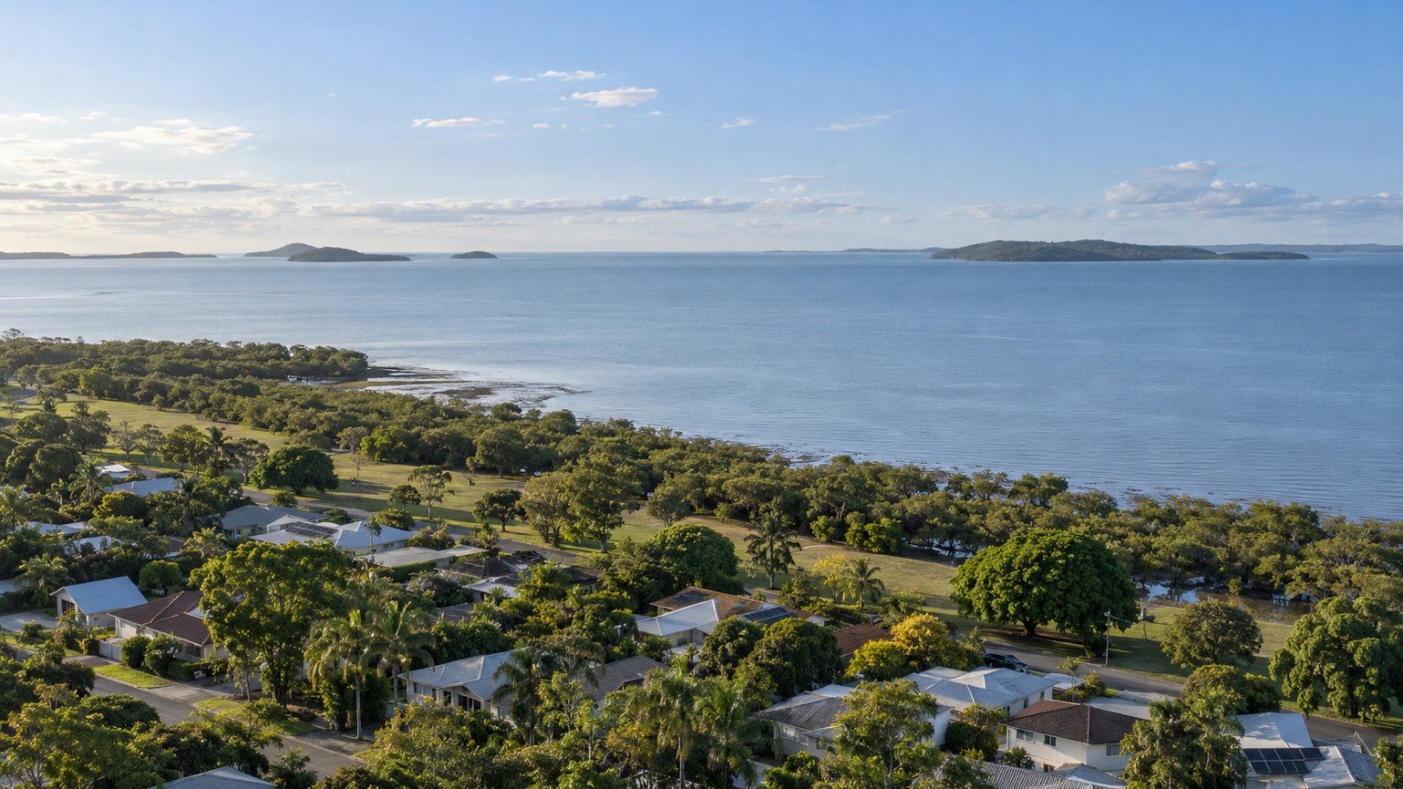 Redlands landscape of leafy bayside streets, open reserve and the calm waters of Moreton Bay beyond