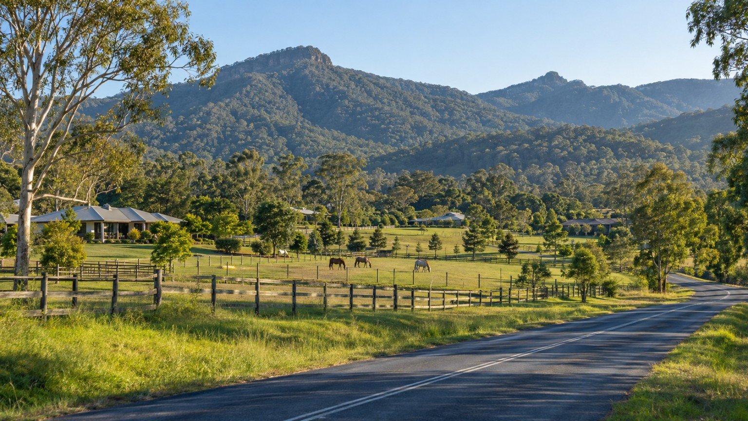 Semi-rural Gold Coast hinterland village with acreage homes and forested ranges beyond