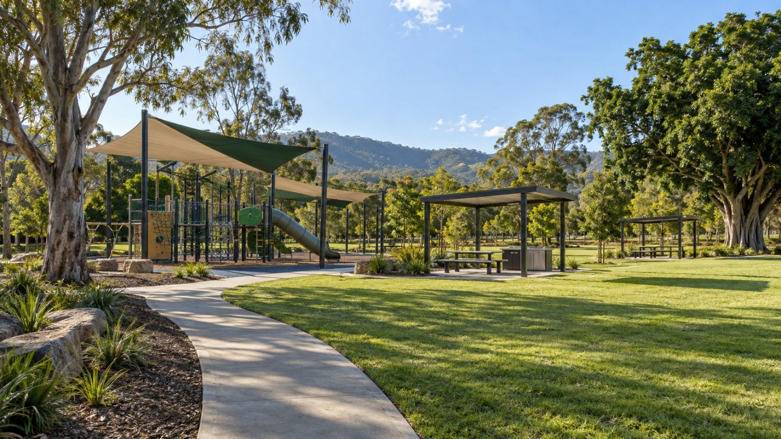 District park with playground under shade sails, picnic shelters and open lawn in an outer western suburb