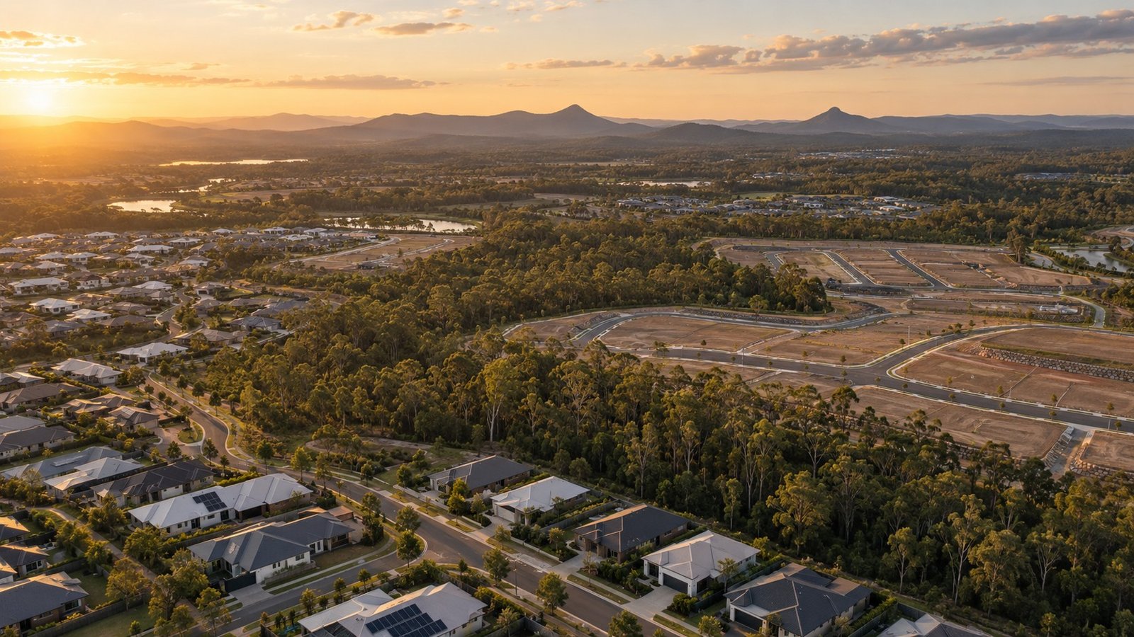 Master-planned community growth with new homes, roads and retained bushland